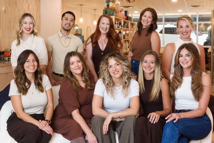Group of people posing together in a casual indoor setting